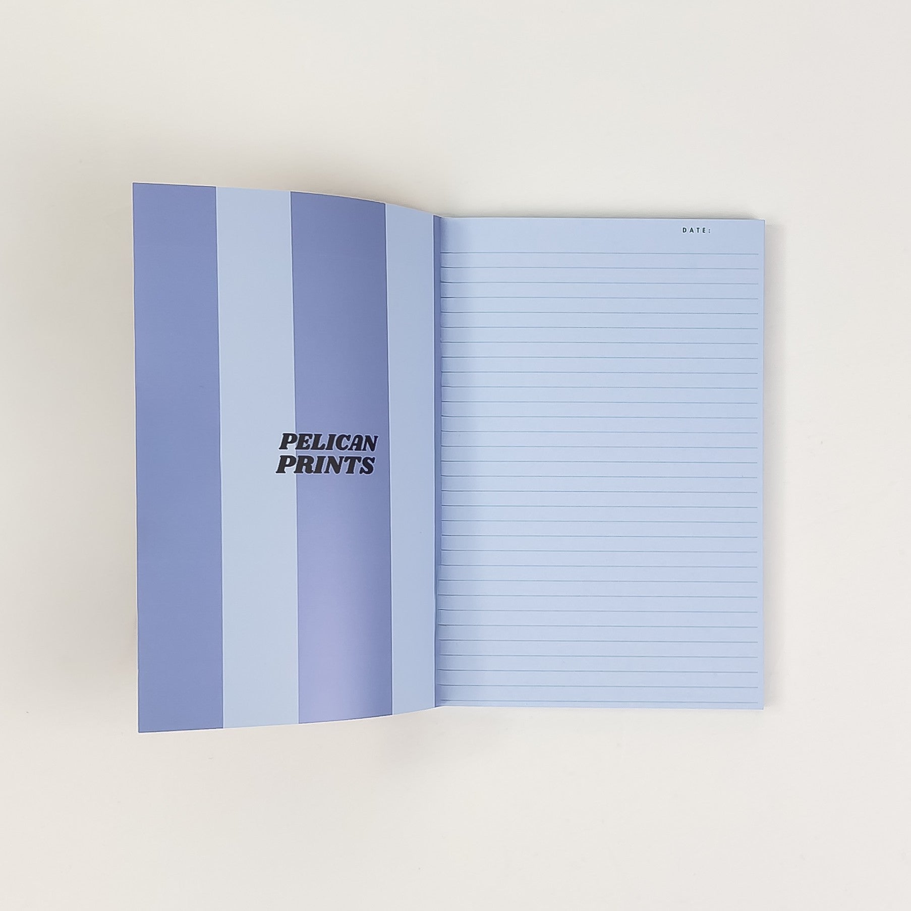 Softcover Notizbuch A6 aufgeschlagen mit linierten Seiten – Pelican Prints