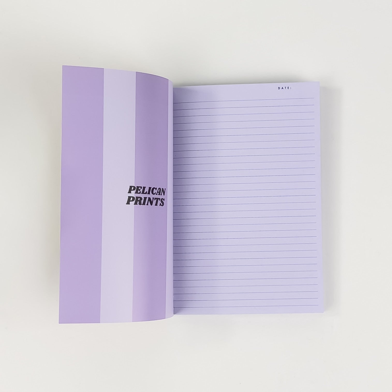 Softcover Notizbuch A6 aufgeschlagen mit linierten Seiten – Pelican Prints